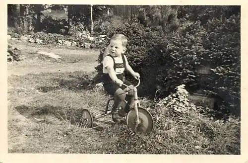 boy with tricycle