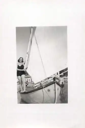 Woman posing near sailing boat 1942