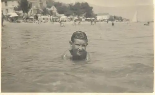 Social history photo young boy in the sea