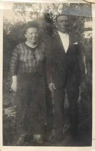 Social history photo elegant couple ion the yard