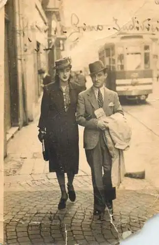 Social history photo elegant couple in city and tram