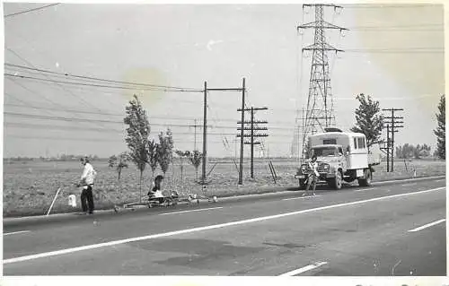 Postcard electricians working in the field
