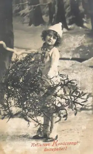 Postcard child posing in Winter with tree