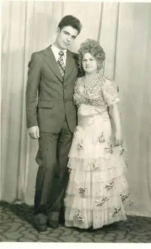 Postcard photograph of elegant couple at social gathering
