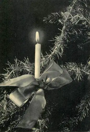 Christmas greetings lit candle with bow decorative ornament