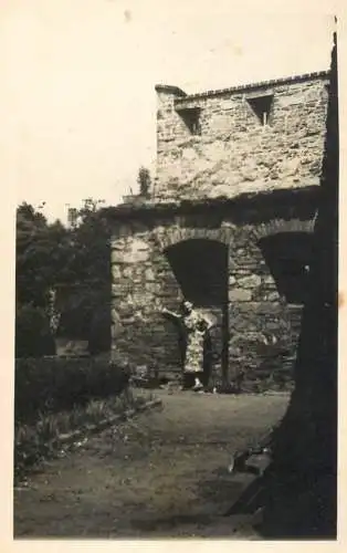 Real photo social history woman and stone house