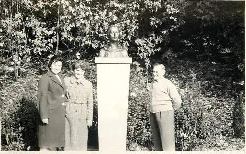 Real photo social history family and statue