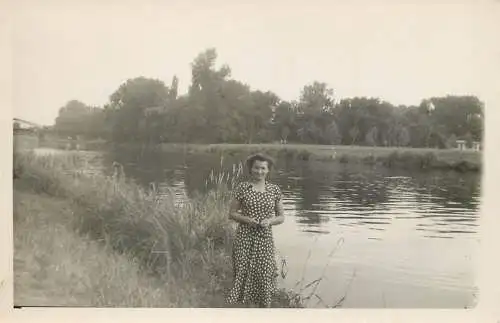 Real photo elegant woman river