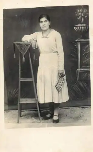 Young lady vintage studio portrait souvenir photo postcard