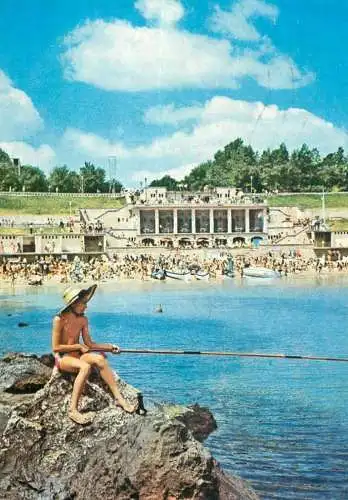 Romania Eforie Nord view of the beach and boy fishing