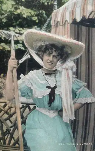 English actress and singer of the Victorian and Edwardian eras Miss Marie Studholme pearls coiffure dress smile hat