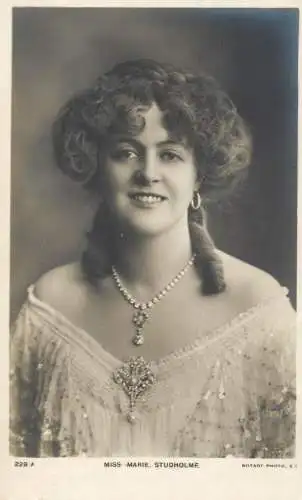 English actress and singer of the Victorian and Edwardian eras Miss Marie Studholme pearls coiffure dress