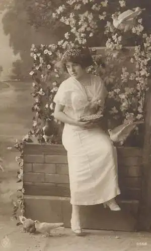 Woman feeding doves