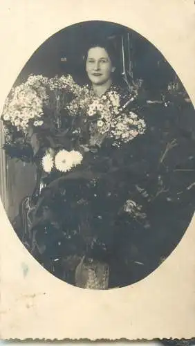 Woman with flowers dated 1938