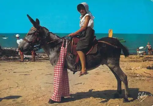 France Ile de Re French peasant woman riding a donkey