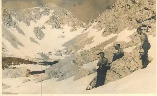 Postcard place to identify rock climbers on mountain peak
