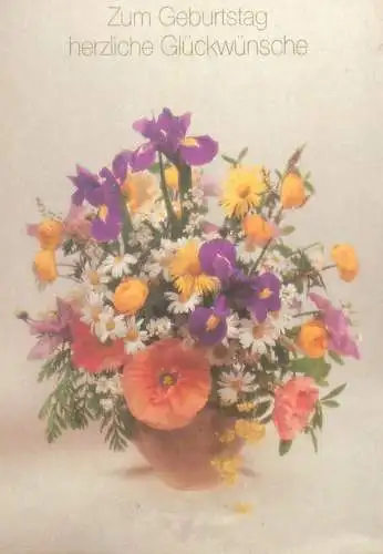 Birthday greetings colourful floral arrangement