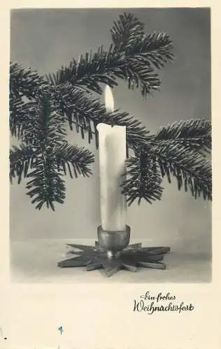 Christmas greetings fir tree branch lit burning candle