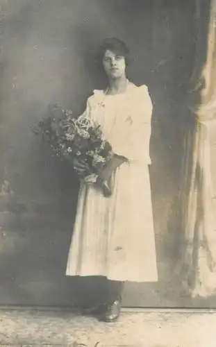 Vintage studio photography atelier photographers anonymous person elegant white dress beautiful woman flower bouquet