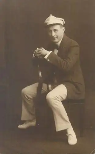 Vintage studio photography atelier anonymous person portrait social history smiling elegant young gentleman picture
