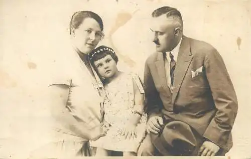 Vintage studio photography atelier anonymous person portrait parents and little girl social history family photo