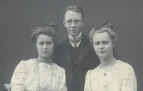 Vintage studio photography atelier anonymous person portrait elegant beautiful young man and women group photo