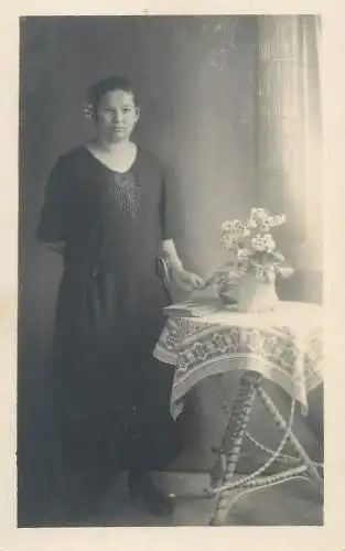 Vintage studio photography atelier photographers anonymous person portrait woman photo vase floral arrangement