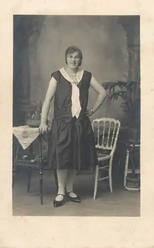 Vintage studio photography atelier anonymous person smiling elegant lady real photo portrait