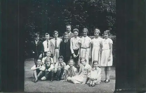 Postcard school children types with teacher group photo