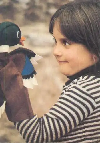 Postcard children scenes girl playing with toy duck outside innocence joy smile beauty