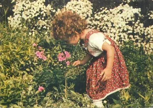 Postcard children types young girl picking flowers