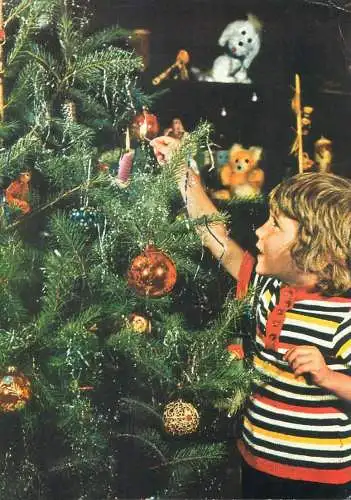 Christmas cheer Postcard young boy decorating fir tree