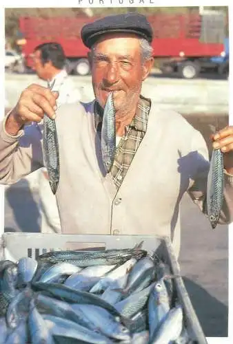 Postcard Portugal fisherman holding fish in hands and mouth