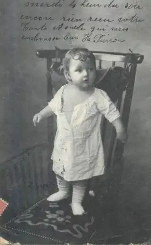Postcard little girl standing on chair photo