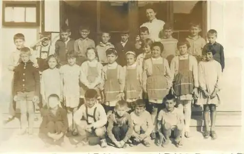 Postcard real photo social history school children types with teacher group picture