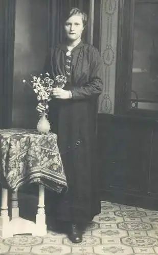 Postcard real photo social history elegant woman with vase flower bouquet