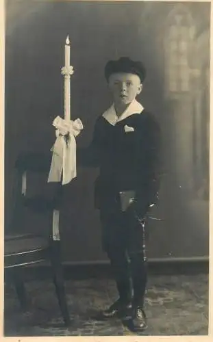 Postcard real photo young boy holding candle elegant costume Augsburg Fotohaus Dom M. Lang