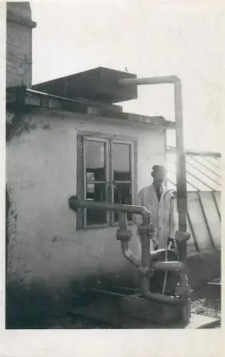 Post card man taking water from outside faucet real photo social history