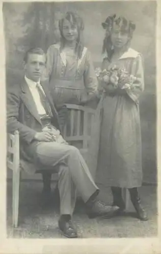 Postcard elegant young man and beautiful young women group picture types and scenes real photo social history