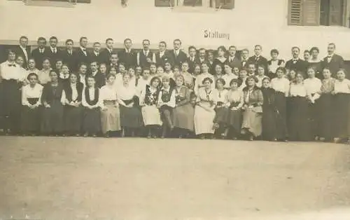 real photo social history memory Postcard elegant men and women group picture Stallung gebaude