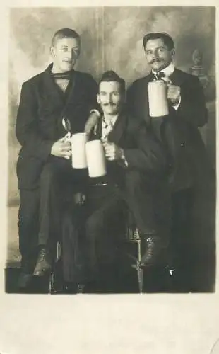 real photo social history memory Postcard elegant costumes gentlemen with beer mugs group picture