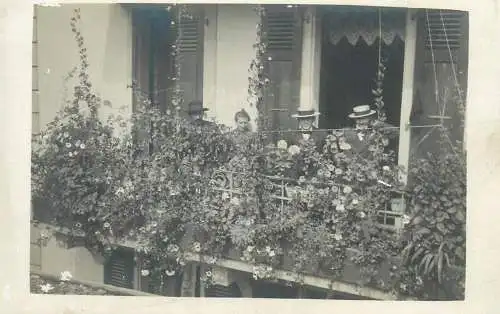 real photo social history memory postcard men and women on flower decorated balcony