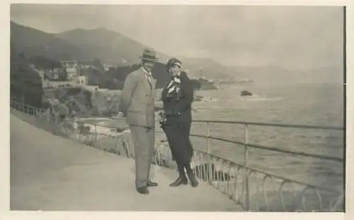 Postcard elegant couple seaside promenade