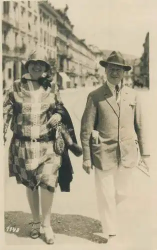 Postcard charming, elegant couple city walk