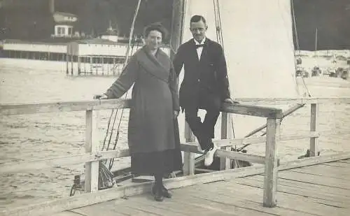 Postcard tourist couple on pier