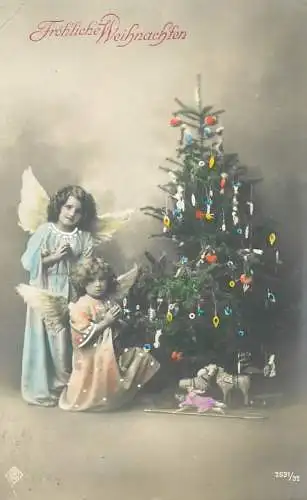 Frohliche Weihnachten Postcard angel types next to decorated Christmas tree