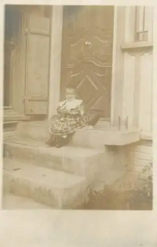 Children portrait vintage photo Postcard crying little girl on stair steps