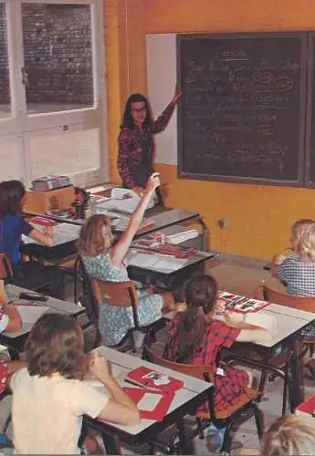 Postcard children types in classroom with teacher