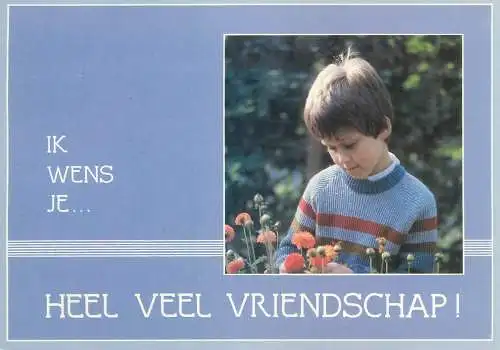 I wish you lots of friendships greeting Postcard young boy admiring flowers