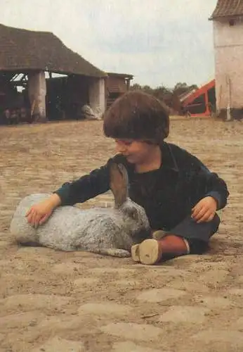 Postcard young boy with rabbit